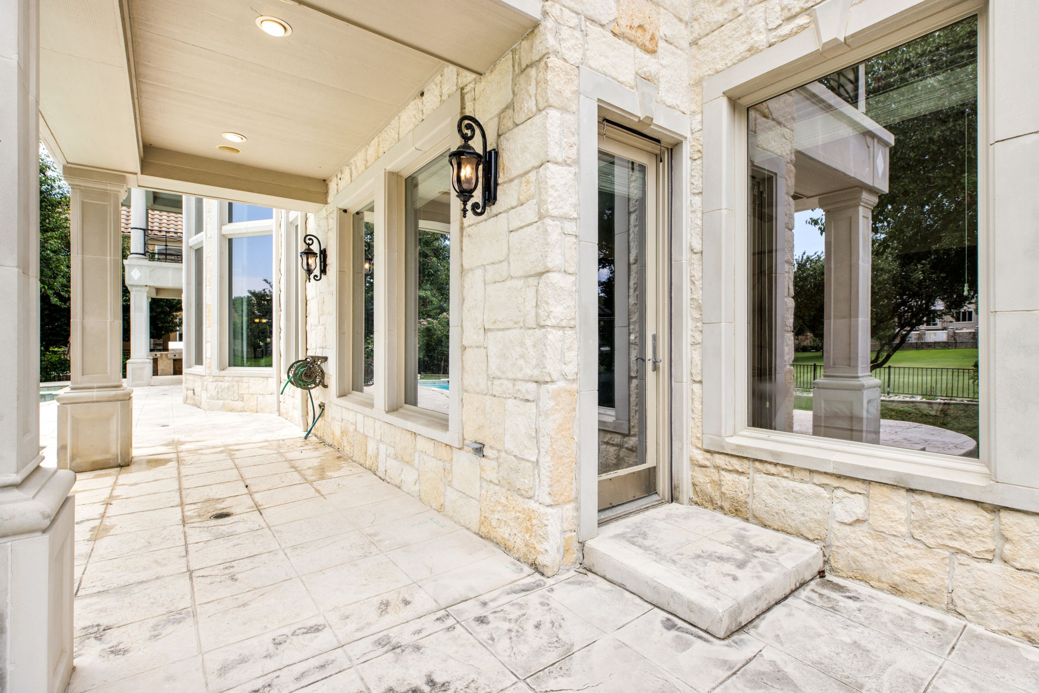 Covered patio along the back of the home